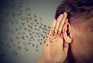 letters coming out of a man's ear 
